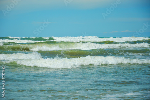 sea waves. turquoise water. summer sea with a sandy shore. warm summer, sun, rest. background for the design.