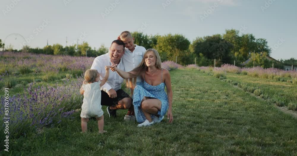 Cheerful family with children on lavender field Cheerful family with children on lavender field