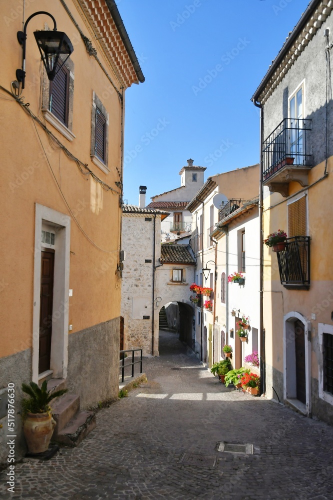 Fototapeta premium A narrow street between the old stone houses of Cansano, a medieval village in the Abruzzo region of Italy.