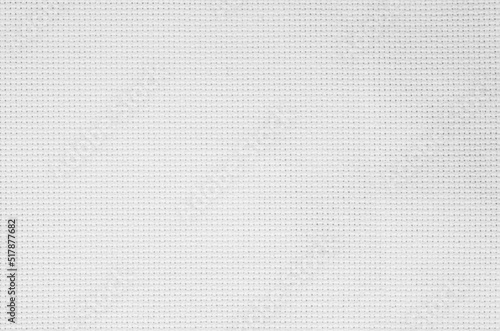 White fabric jute hessian sackcloth canvas woven gauze texture pattern in light white color blank. Natural linen and cotton cloth texture as clean background empty for decoration. 