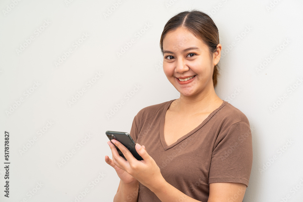 Asian women using smartphone on white bakcground Asian women using smartphone on white bakcground