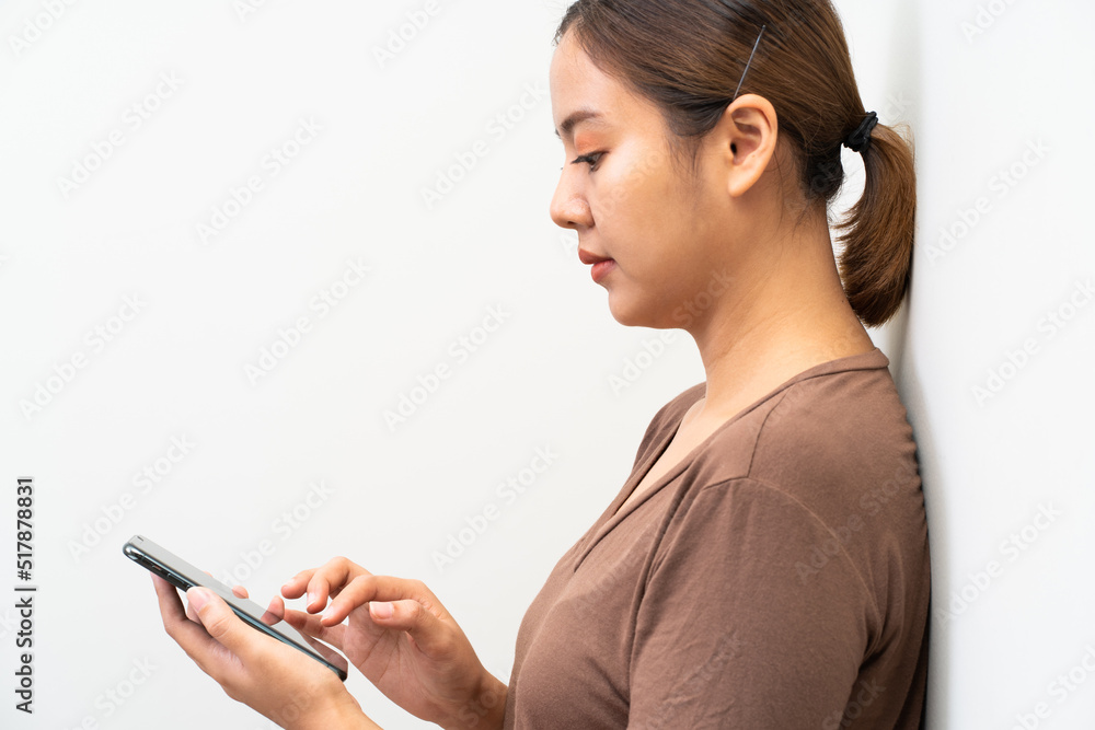 Asian women using smartphone on white bakcground Asian women using smartphone on white bakcground