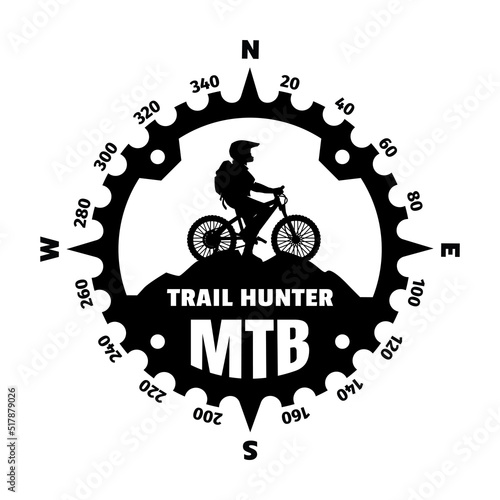 Mountain biker, logo in the form of a compass. Vector illustration.