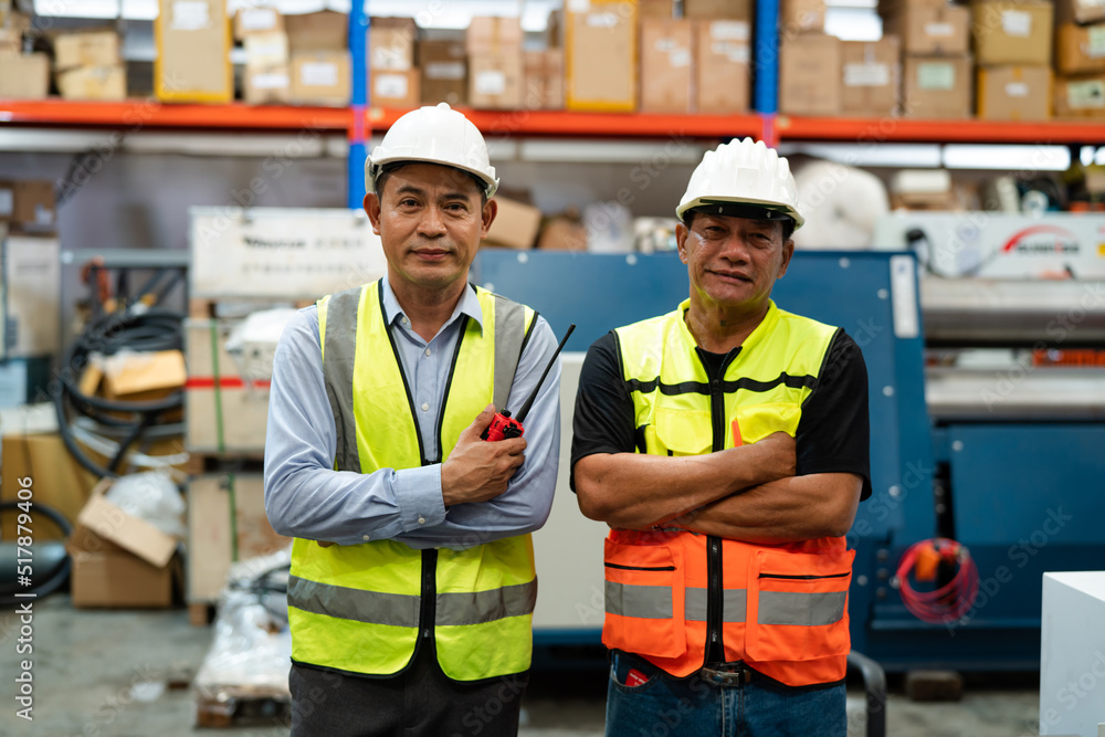Factory worker foreman and engineer manager working together at warehouse. Factory worker foreman and engineer manager working together at warehouse.