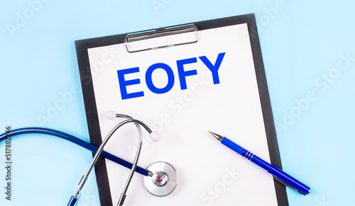 Wallpaper Mural On a blue background, a stethoscope, a pen and a tablet with paper and the text EOFY. Medical concept Torontodigital.ca