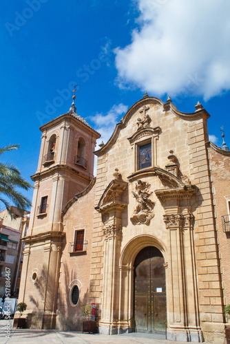 Nice facade with tower and bell tower of the church of Santa Eulalia in Murcia, in baroque style
