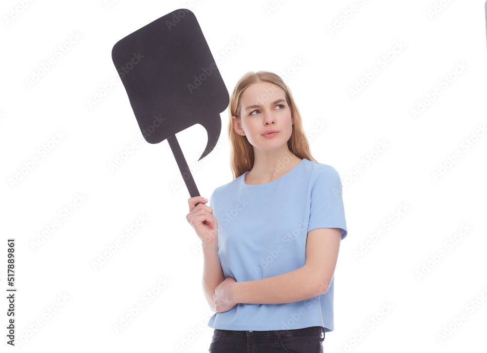 Vivacious young woman winking and laughing as she points at a blank signboard with copy space. Vivacious young woman winking and laughing as she points at a blank signboard with copy space.