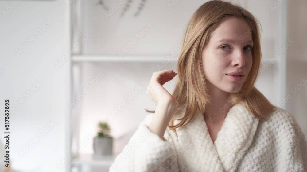 Natural beauty. Morning freshness. Organic skincare. Satisfied confident woman with clean radiant flawless face skin in light blur bathroom interior with free space. Natural beauty. Morning freshness. Organic skincare. Satisfied confident woman with clean radiant flawless face skin in light blur bathroom interior with free space.