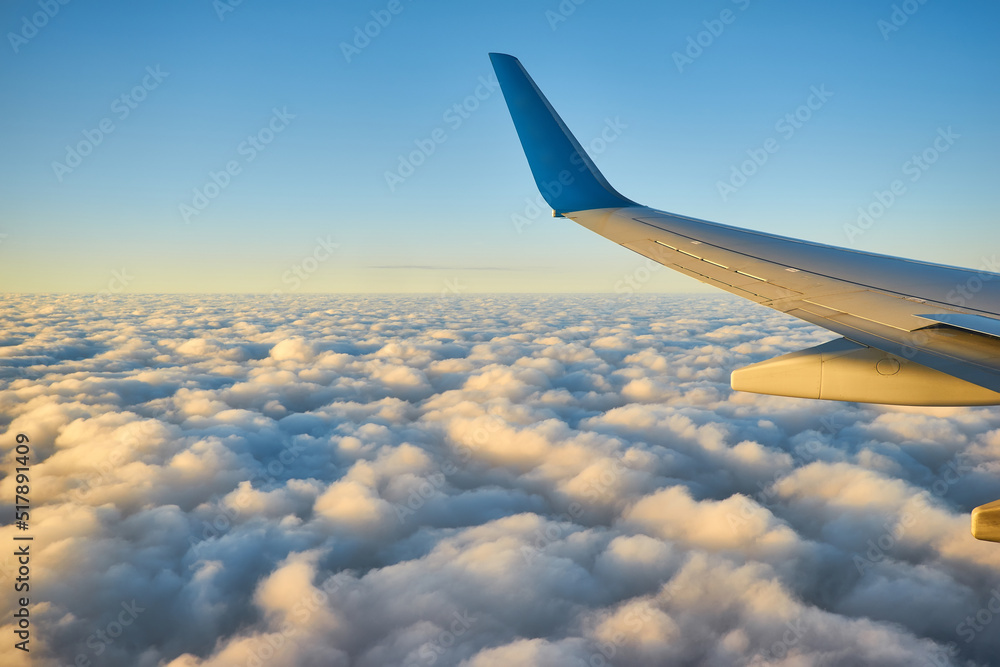 Obraz premium View of the beautiful sky and clouds from the window of the airplane. Sunset sky from the window of the airplane.