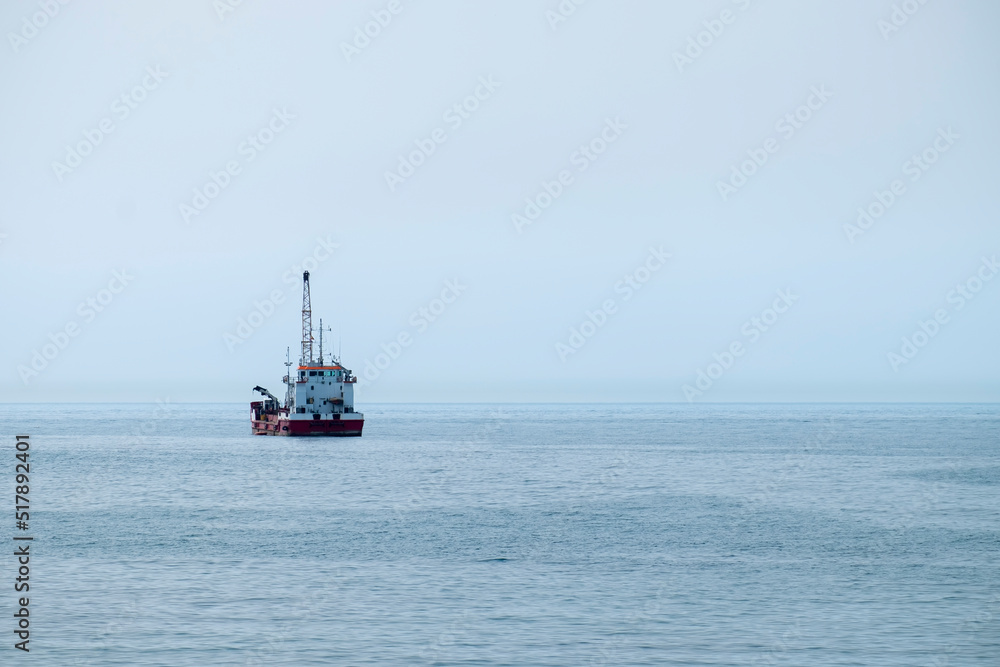 Hopper dredger vessel in the sea