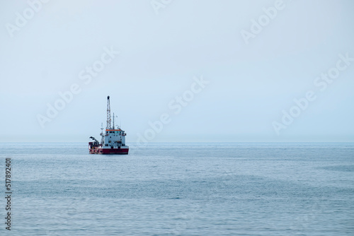 Hopper dredger vessel in the sea