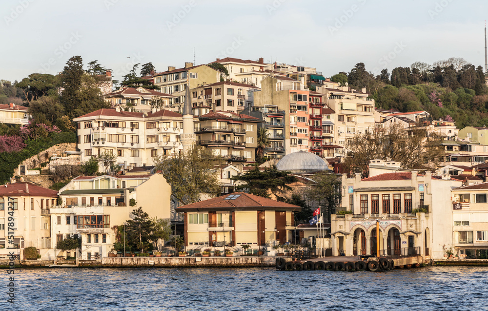 View over the houses and villas on the coastline of Bosphorus strait. View from the touristic boat during the cruise on Bosporus