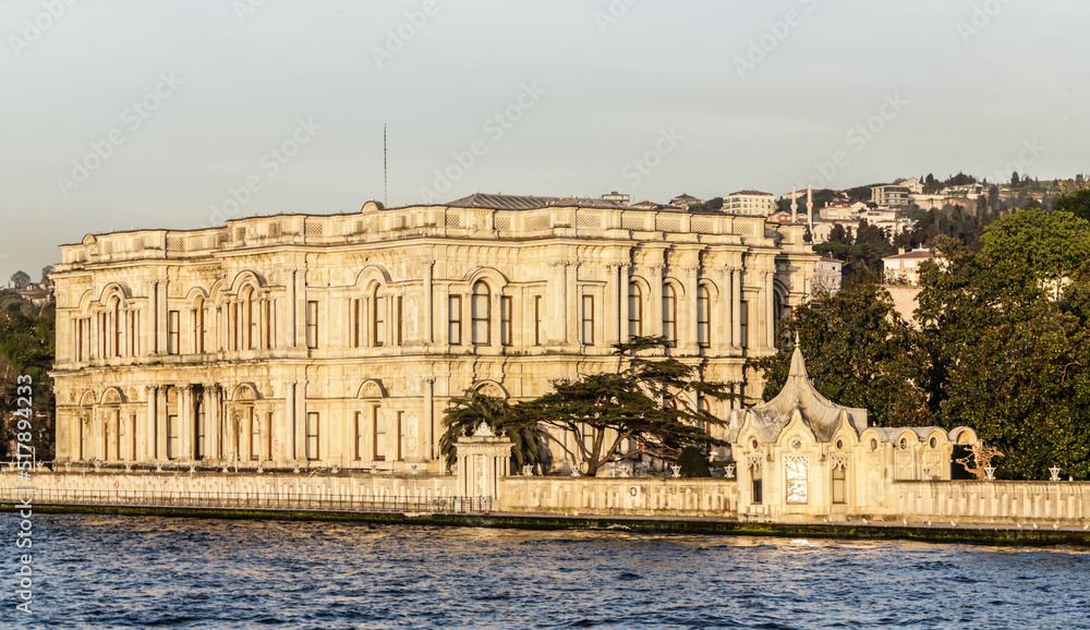 Beylerbeyi Palace on the coastline of Bosporus strait in golden hour. View from touristic boat on Bosporus. Istanbul, Turkey Beylerbeyi Palace on the coastline of Bosporus strait in golden hour. View from touristic boat on Bosporus. Istanbul, Turkey