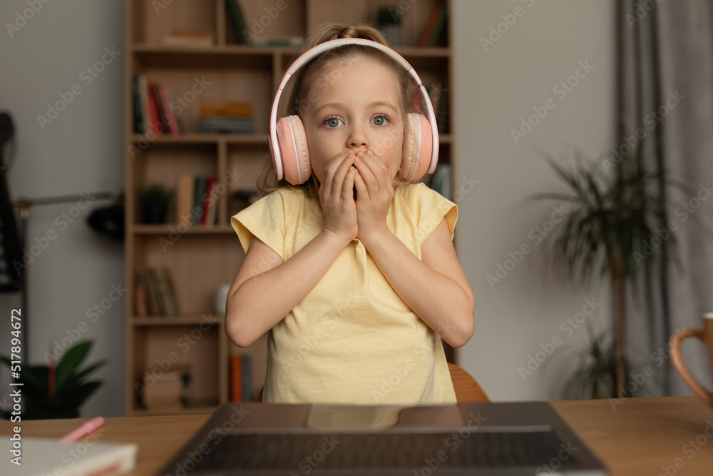 Shocked Kid Girl Looking At Laptop Making Video Call Indoor Shocked Kid Girl Looking At Laptop Making Video Call Indoor