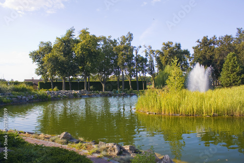 Lake in the park in Mezhyhirya (former ex-president residence of President Yanukovych) in Kyiv region, Ukraine	 photo