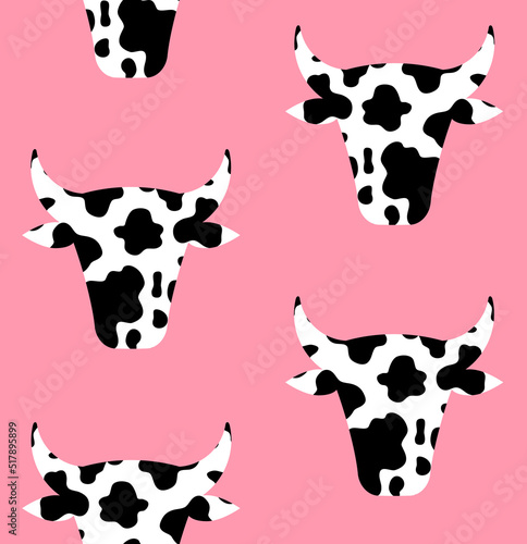 Vector seamless pattern of flat cow head with cow print isolated on pink background