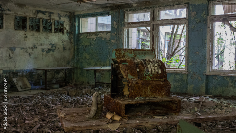 Cash register in the cafeteria destroyed abandoned building in ghost city Pripyat after explosion fourth reactor Chernobyl nuclear power plant. Ukraine. Radiation, catastrophe