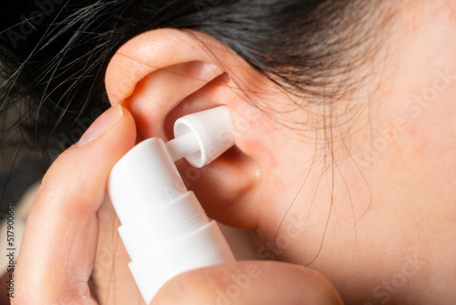 Using spray to remove earwax