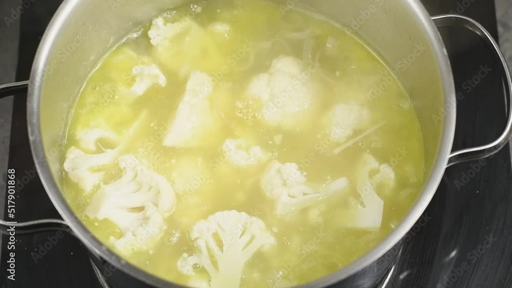 Cooking cauliflower soup in a pot. Cooking cauliflower soup in a pot.