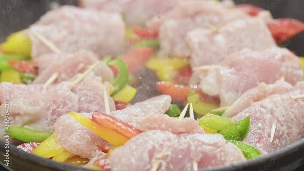 Cooking juicy teriyaki pork rolls with bell peppers. Cooking juicy teriyaki pork rolls with bell peppers.