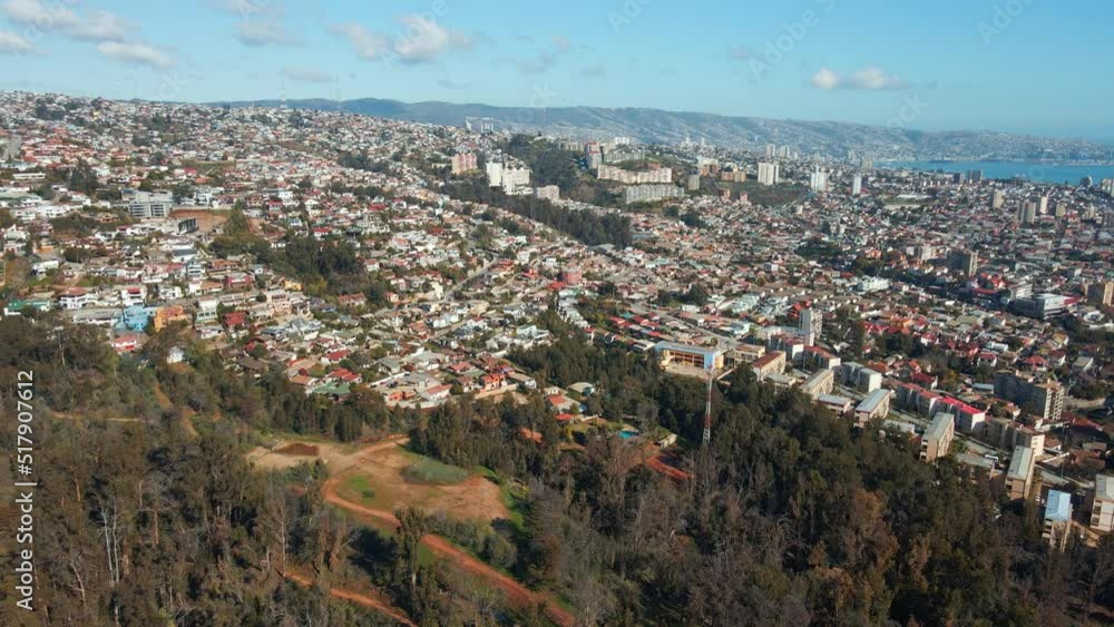 Aerial pan right of Viña del Mar city buildings panormic view from hill, mountains and sea in background, Chile Aerial pan right of Viña del Mar city buildings panormic view from hill, mountains and sea in background, Chile
