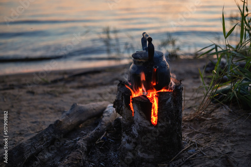 Kettle on the fire. Cooking outdoors. photo