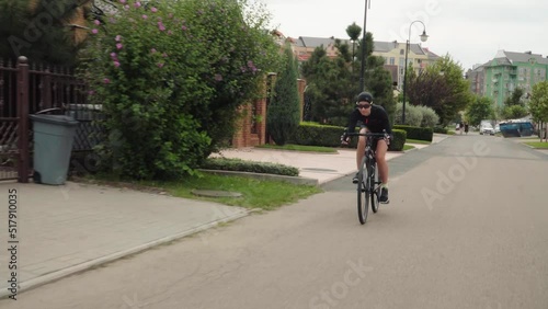 Beautiful summertime mood shot of young woman or girl riding bicycle