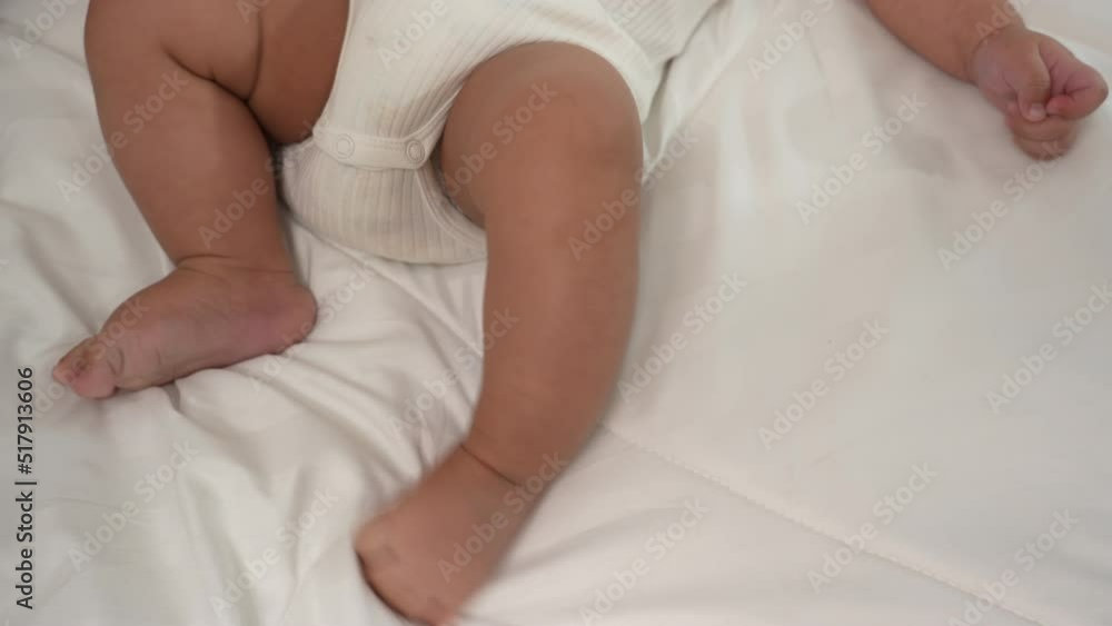 Foots holding of mother parent soft touch newborn baby fingers love family concept. Infant child portrait happy healthy. Foots holding of mother parent soft touch newborn baby fingers love family concept. Infant child portrait happy healthy.