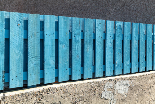 18 July 2022. Lossiemouth, Moray, Scotland. This is the fence on a domestic house in the old seatown part of Lossiemouth on a very sunny afternoon. photo