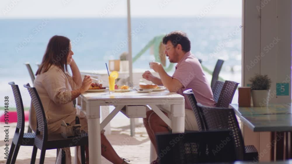 4K SlowMo - Delicious breakfast at a beach bar - watermelon, kiwi, orange, juice, coffe, jam, eggs, bacon- lovely couple having breakfast at beach bar in Conil, Cádiz, Spain 4K SlowMo - Delicious breakfast at a beach bar - watermelon, kiwi, orange, juice, coffe, jam, eggs, bacon- lovely couple having breakfast at beach bar in Conil, Cádiz, Spain