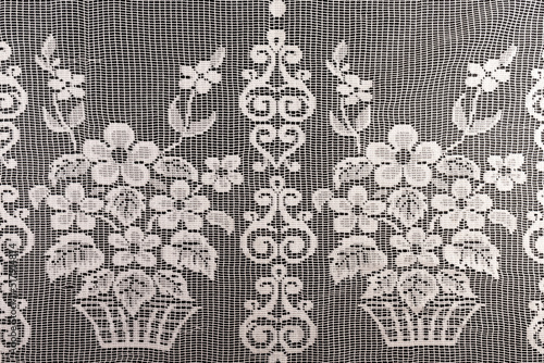 Tulle fabric, seamless texture with beautiful close-up and elegant details of the fabric background. Luxury tulle textile pattern with soft vintage material.