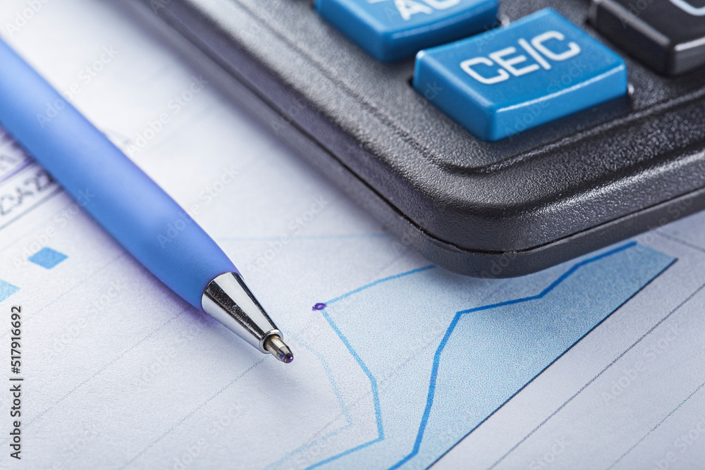 Accounting document with pen, money, coins and checking financial chart. Concept of banking, financial report and financial audit. Accounting document with pen, money, coins and checking financial chart. Concept of banking, financial report and financial audit.