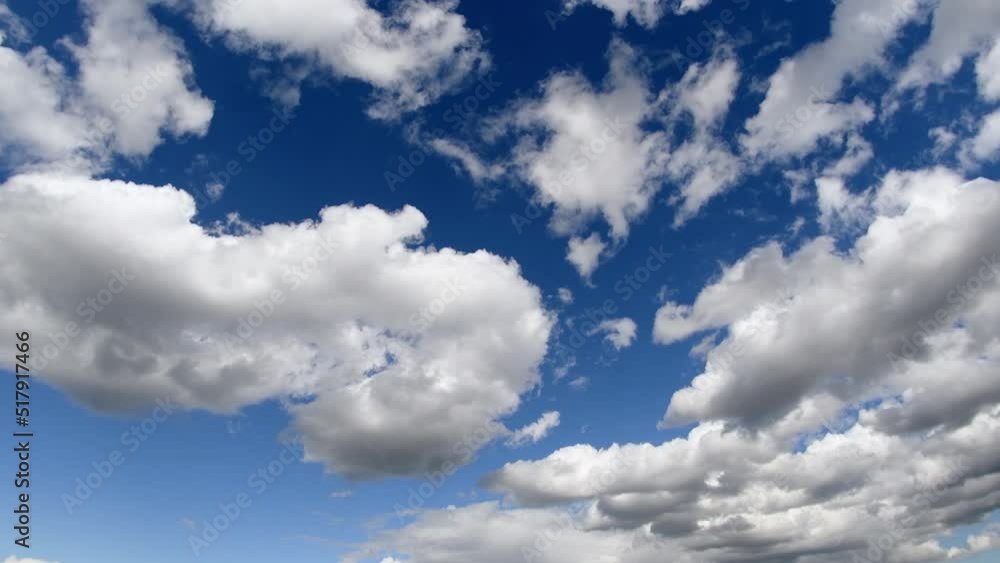 Large cumulus clouds move across the sky. Dark clouds are constantly changing their shape. Large cumulus clouds move across the sky. Dark clouds are constantly changing their shape.