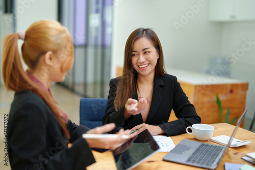 Portrait of an Asian businesswoman consulting, start up a marketing plan to meet the needs of customers in office room. © Jirapong