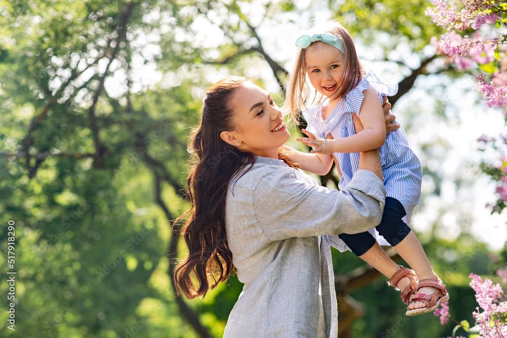 family, motherhood and people concept - happy mother with little daughter at summer park or garden family, motherhood and people concept - happy mother with little daughter at summer park or garden
