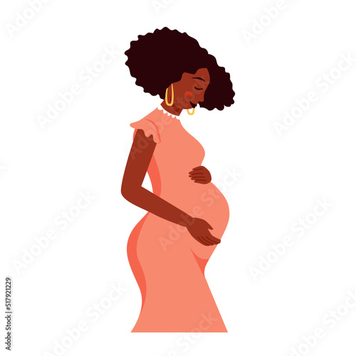 Young beautiful pregnant black woman hugging her tummy