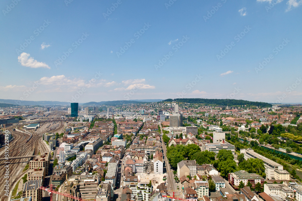 Aerial view of cityscape of City a sunny with local mountain in the background summer day. Photo taken June 20th, 2022, Zurich, Switzerland.