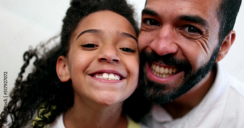 Father and daughter smiling at camera. real casual people. Child and dad Father and daughter smiling at camera. real casual people. Child and dad