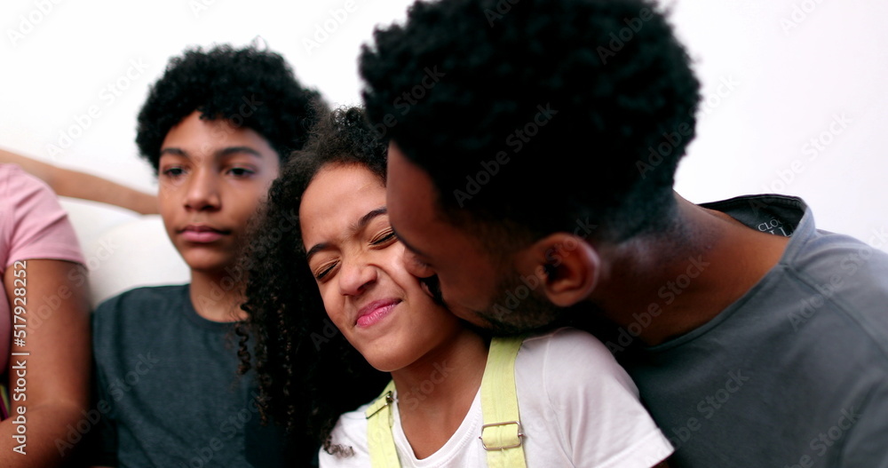 Family love, older brother kissing sister on cheek Family love, older brother kissing sister on cheek