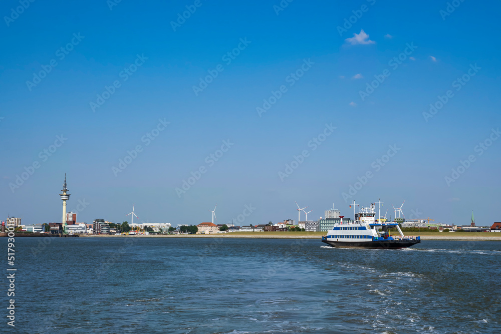 View of the ferry across the Weser to Bremerhaven/Germany with the harbor entrance in the background View of the ferry across the Weser to Bremerhaven/Germany with the harbor entrance in the background