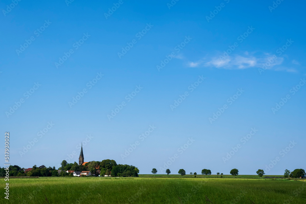 View over fields to Langwarend/Germany in Butjadingen on the North Sea View over fields to Langwarend/Germany in Butjadingen on the North Sea