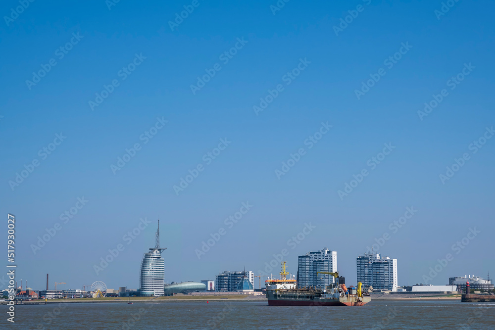 View over the Weser towards the skyline of Bremerhaven/Germany