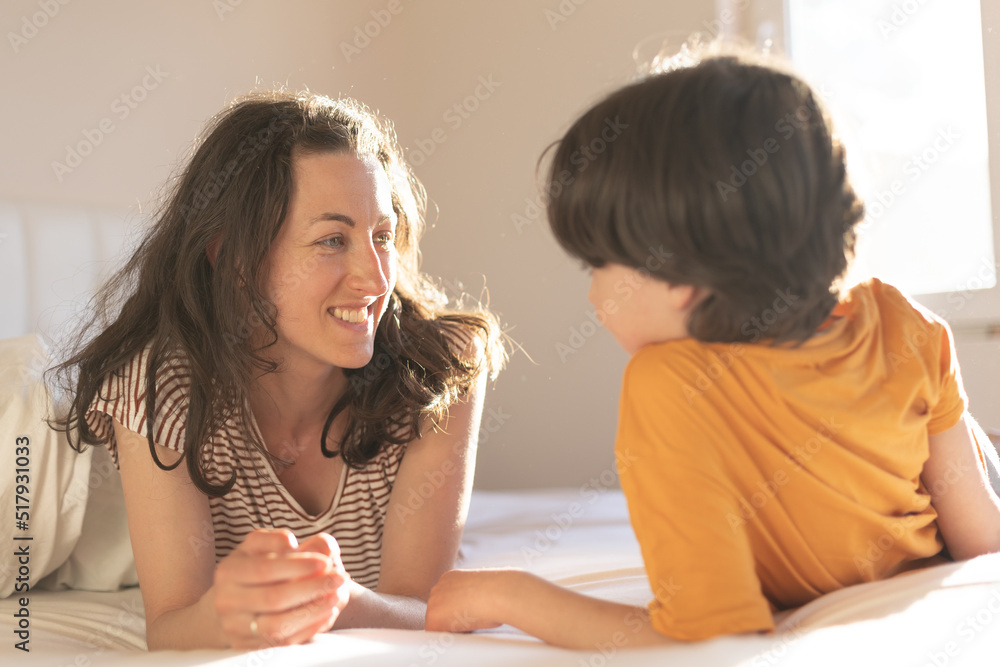 the boy with his mother lies on the bed the boy with his mother lies on the bed