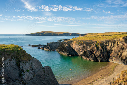 A landscape view of  the coast of  cardigan  bay with the island in the distance  in West Wales