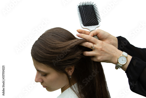 the hairdresser combs his hair with a square comb, makes a hairstyle, isolated