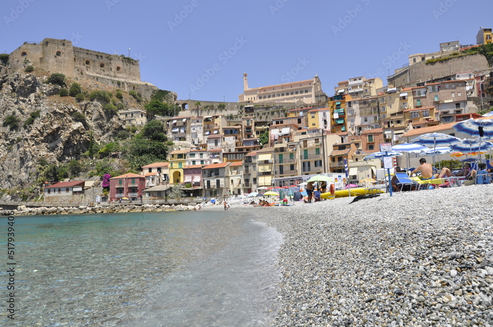 Crystal clear water, at the sight of a typical village on the coast. Southern Italy