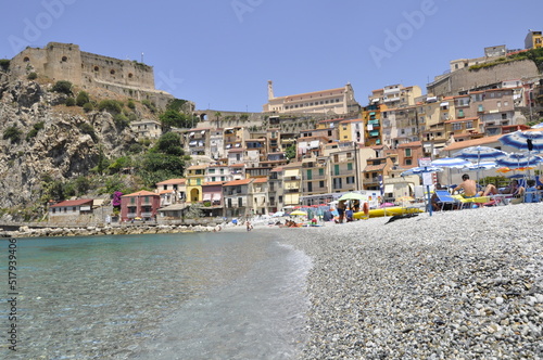 Crystal clear water, at the sight of a typical village on the coast. Southern Italy