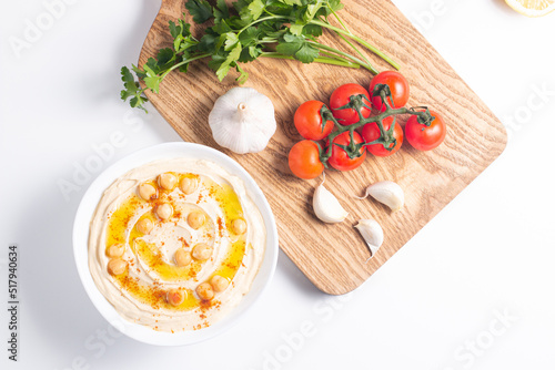 Delicious hummus with chickpeas, olive oil, lemon and pita bread. Vegetarian food concept.