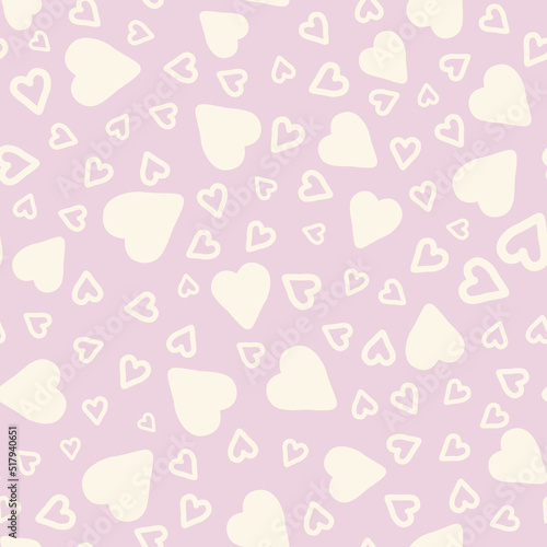 Cream pastel hearts over light pink background