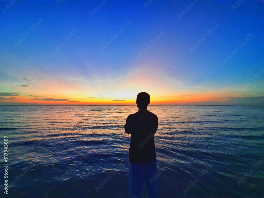 Silhouette of a Person on the Beach